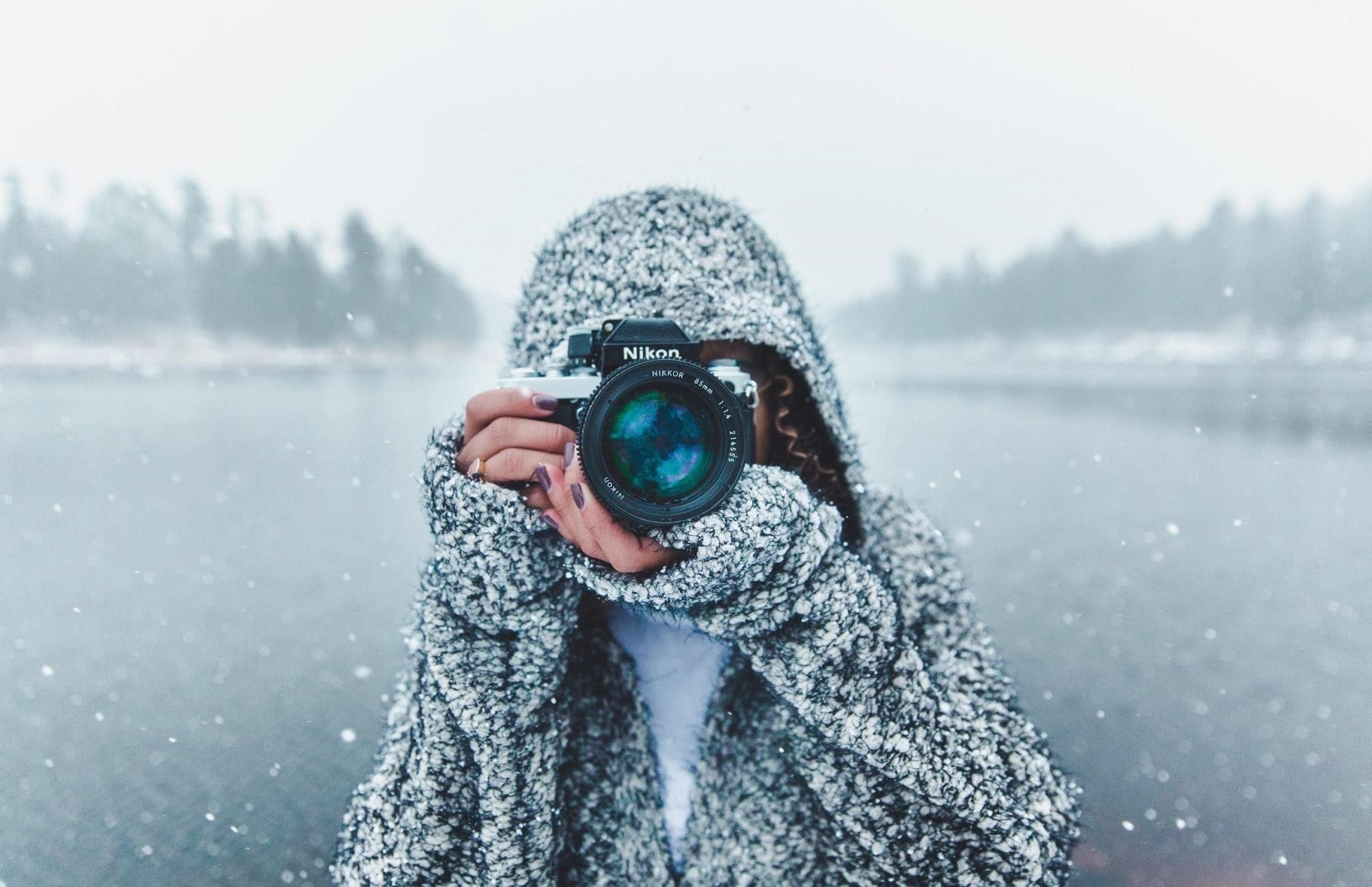 Girl with camera taking photos for blog posts