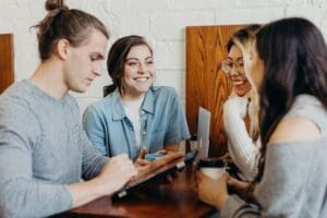 people looking at table for clear information from a website